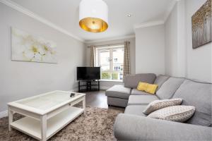 a living room with a couch and a coffee table at Modern New Build in Dublin in Dublin