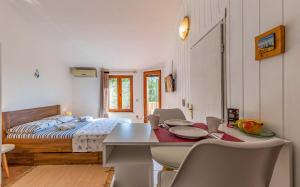 Postel nebo postele na pokoji v ubytování Apartment Eva