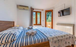 Postel nebo postele na pokoji v ubytování Apartment Eva