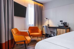 Postel nebo postele na pokoji v ubytování Radisson RED Berlin Kudamm