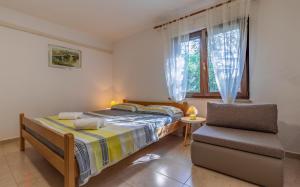 Postel nebo postele na pokoji v ubytování Apartment Eva