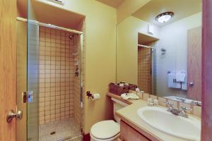 a bathroom with a toilet and a sink and a shower at Watch Hill Condos Unit 614 in Silverthorne +26 photos