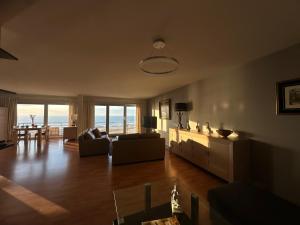 a living room with a view of the ocean at Zeezicht in Ostend