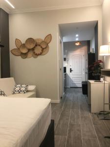 a hotel room with a bed and a hallway at Maravilloso Apartamento Copacabana in Rio de Janeiro