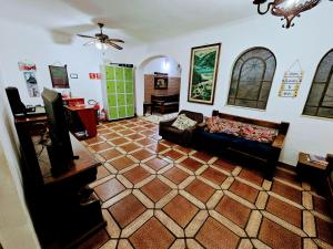 a living room with a couch and a table at Deck Hostel Congonhas in Sao Paulo