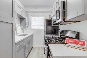 a kitchen with a i love you sign on the counter at Private Ocean Dr Apt w/2 Queen Beds, Steps 2 Beach in Miami Beach
