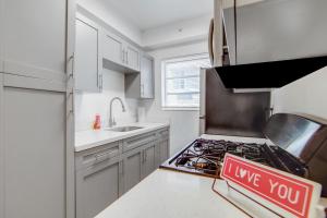 a kitchen with a sign that says i love you at Private Ocean Dr Apt w/2 Queen Beds, Steps 2 Beach in Miami Beach