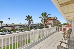 a balcony with a view of a street at Galvez Oceanview Retreat Walk to Beach or Pleasure Pier in Galveston