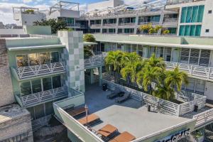 an overhead view of a building with palm trees at Private Ocean Dr Apt w/2 Queen Beds, Steps 2 Beach in Miami Beach