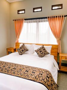 Postel nebo postele na pokoji v ubytování Homestay D'BANDEM