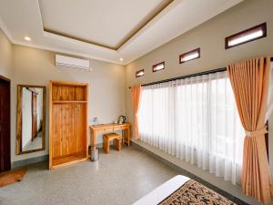 Postel nebo postele na pokoji v ubytování Homestay D'BANDEM