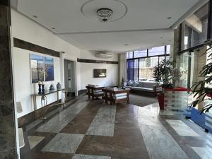 a living room with a couch and a table at Atlantic City Apart Service in Salvador