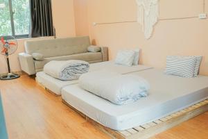 Postel nebo postele na pokoji v ubytování Trang Trại Gia Trịnh