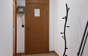 a wooden door in a room with at Awesome Apartment In Alicante With Wifi in Alicante