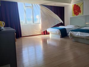 A bed or beds in a room at Juli Boutique Hotel