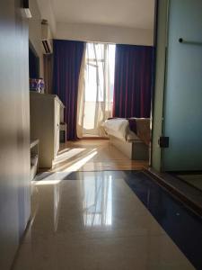 A bed or beds in a room at Juli Boutique Hotel