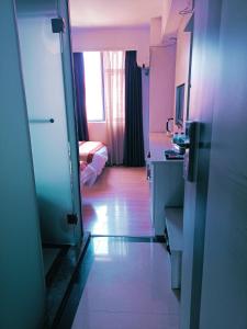 A bed or beds in a room at Juli Boutique Hotel