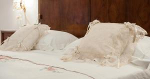 two white pillows sitting on top of a bed at Villa Anna Savini Casa Vacanze in Atri