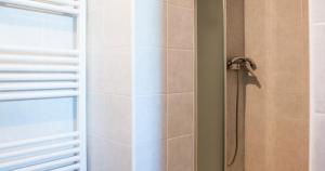 a bathroom with a shower with a glass door at Villa Anna Savini Casa Vacanze in Atri +49 photos