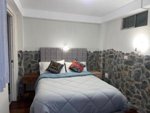 Postelja oz. postelje v sobi nastanitve intikilla hostal