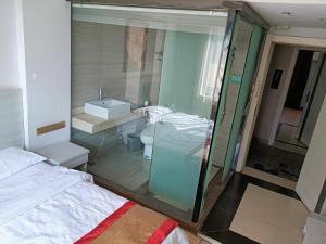 A bed or beds in a room at Juli Boutique Hotel