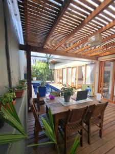 O zonă de relaxare la Camburi Beach House - Casa térrea a 50 m da praia