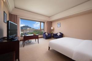 TV a/nebo společenská místnost v ubytování Parklane Hotel Changan