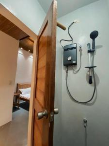 a shower in a room with a shower at Helmina's Villas in General Luna +113 photos