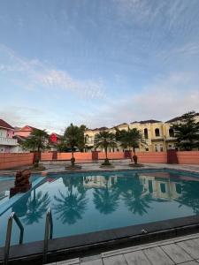 a large swimming pool in front of a building at Villa Dream HillPark Sibolangit BerastagiView in Bandarbaru
