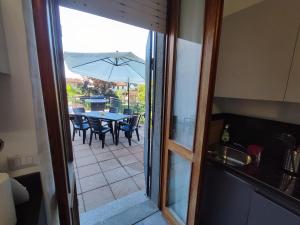 a view of a patio with a table and an umbrella at Casa Lilly in San Paolo Solbrito