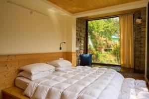 Voodi või voodid majutusasutuse Seegreen Lodges toas