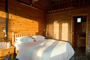 Voodi või voodid majutusasutuse Seegreen Lodges toas