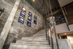 a staircase in a building with blue signs on the wall at UNOTEL Karon Beach in Karon Beach +42 photos