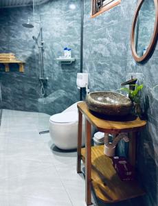 a bathroom with a sink and a toilet and a shower at 6Senses Garden Homestay in Hòa Bình