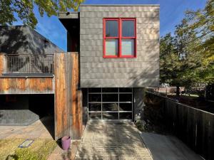 een huis met een rood raam erop bij Stunning Modern Apartment, One Of A Kind! in Bozeman