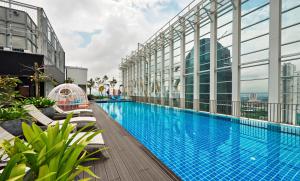 a swimming pool on the roof of a building at Suasana Johor Bahru City Centre by SummerSpace in Johor Bahru