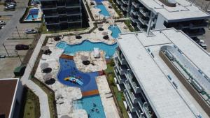 an overhead view of a swimming pool in a resort at Makia Beach experience Flat 115 A in Porto De Galinhas +7 photos