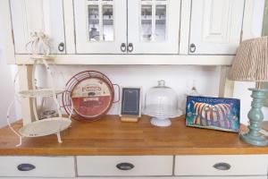 a counter with a clock and other items on it at Penzion Muran in Terchová