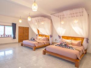 Posteľ alebo postele v izbe v ubytovaní CoCo Breeze Spa Hotel