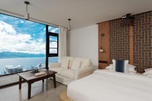 Llit o llits en una habitació de 慢境Slow Land半山海景花园酒店