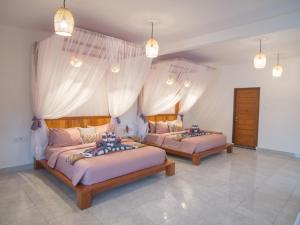 Posteľ alebo postele v izbe v ubytovaní CoCo Breeze Spa Hotel