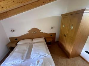 Postel nebo postele na pokoji v ubytování Locanda Castil