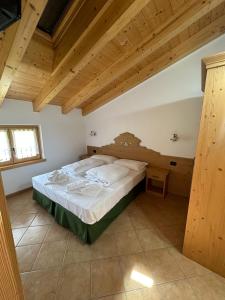 Postel nebo postele na pokoji v ubytování Locanda Castil