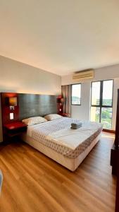 Кровать или кровати в номере EzraAvenue Homesuites - NEAR IMAGO MALL KOTA KINABALU CITY +17 фотографий