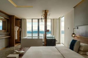 Llit o llits en una habitació de 慢境Slow Land半山海景花园酒店