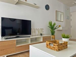 TV a/nebo společenská místnost v ubytování Apartamento Aurora - Ole Solutions