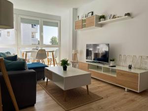 TV a/nebo společenská místnost v ubytování Apartamento Aurora - Ole Solutions