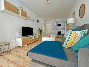 TV a/nebo společenská místnost v ubytování Apartamento Aurora - Ole Solutions