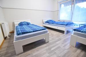 Ein Bett oder Betten in einem Zimmer der Unterkunft Apartment Köln Porz