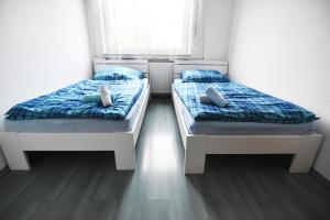 Ein Bett oder Betten in einem Zimmer der Unterkunft Apartment Köln Porz